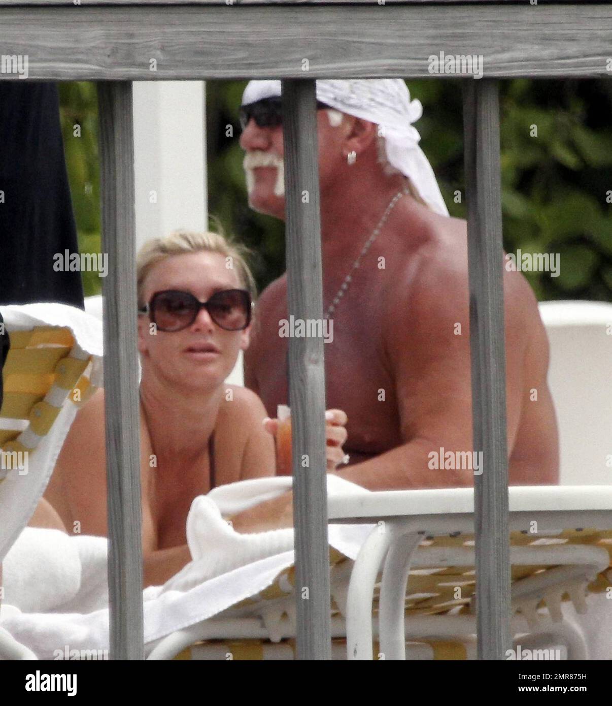 EXCLUSIVE!! Hulk Hogan spends the day poolside with his daughter Brooke and girlfriend Jennifer McDaniel. Brooke Celebrated her 22nd birthday 3 days ago. The Trio soaked up the sun and enjoyed a water-front lunch and drinks. Miami, FL. 5/8/10. Stock Photo