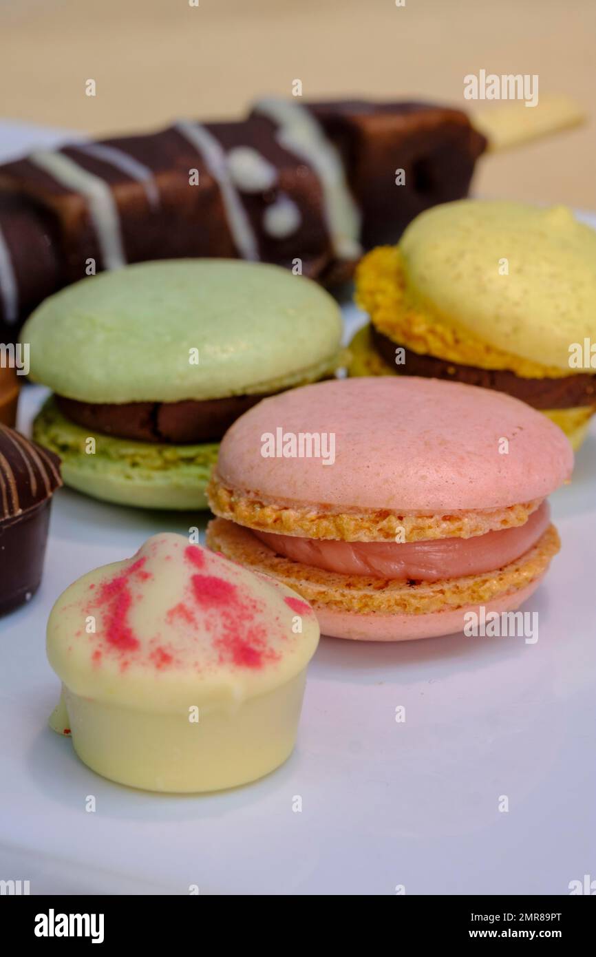 Macrons, sweets on buffet, reception Stock Photo