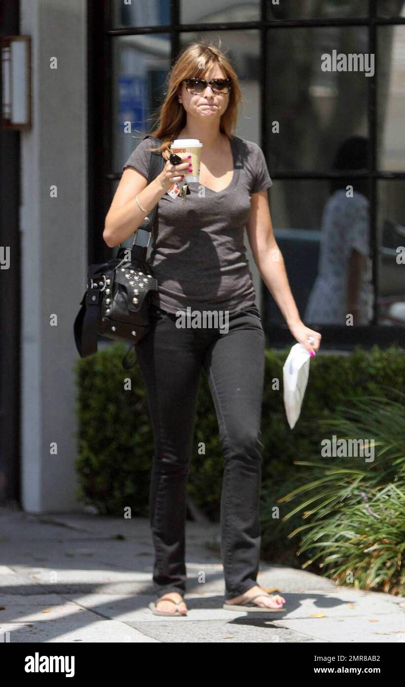 EXCLUSIVE!! Australian actress and pop star Holly Valance was seen out and about in Los Angeles this morning. The 26-year-old singer and "Neighbours" pin-up was seen visiting a medical center in Beverly Hills and left the center with what appeared to be a cup of coffee and prescription medicine. Valance, who wasn't sporting any rings on her fingers, appeared to be happy and fit. It's reported that Valance just released a new CD called "Superstar" and is set to star in the upcoming film "Luster."  Los Angeles, CA.  7/29/09. Stock Photo