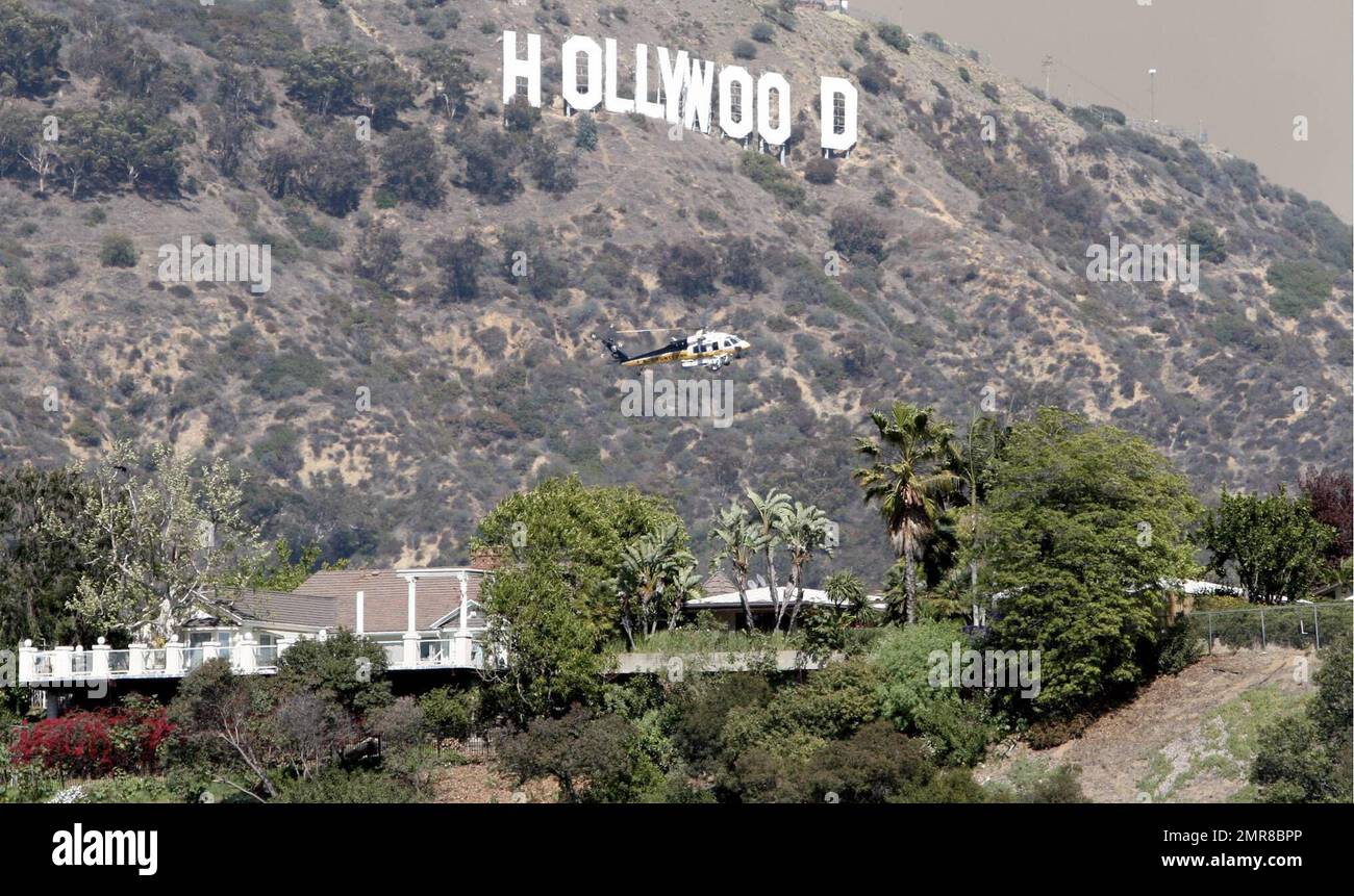 The famous Hollywood sign was in danger today as a fire raged on the ridge behind. Celebrity