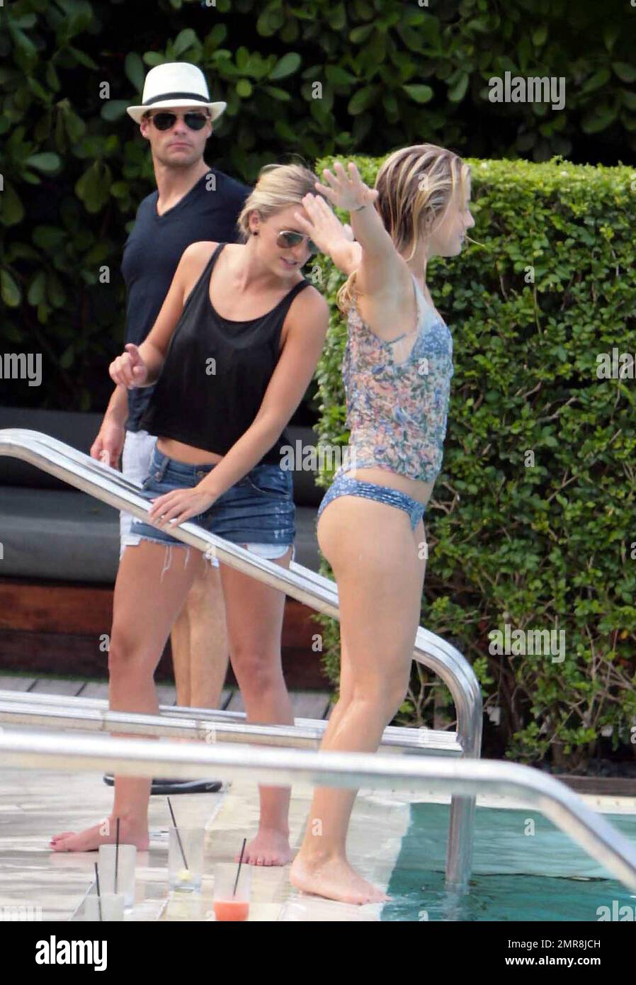 Julianne Hough, spends an early birthday weekend with her boyfriend Ryan Seacrest, brother Derek Hough, mother Mari Anne and best friend Maude who all flew into Miami to be with the actress who is currently filming Rock Of Ages. Julianne wore a blue bikini to take a dip in the hotel pool and also ventured into the ocean with the group who all appeared to be having a great time. Julianne will turn 23 on Wednesday. Miami Beach, FL. 7/16/11. Stock Photo