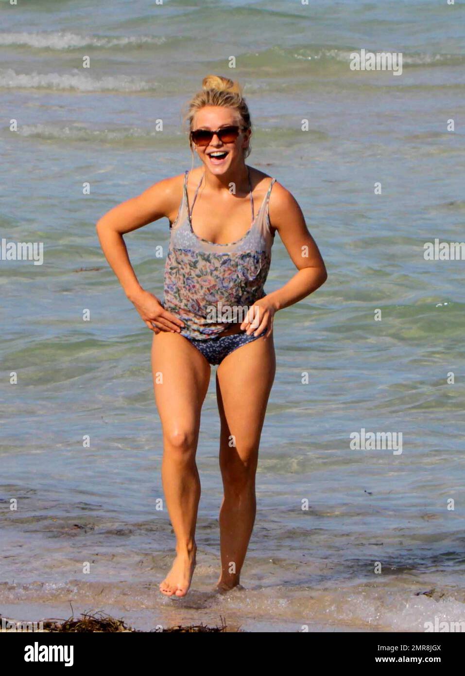 Julianne Hough, spends an early birthday weekend with her boyfriend Ryan Seacrest, brother Derek Hough, mother Mari Anne and best friend Maude who all flew into Miami to be with the actress who is currently filming Rock Of Ages. Julianne wore a blue bikini to take a dip in the hotel pool and also ventured into the ocean with the group who all appeared to be having a great time. Julianne will turn 23 on Wednesday. Miami Beach, FL. 7/16/11.   . Stock Photo