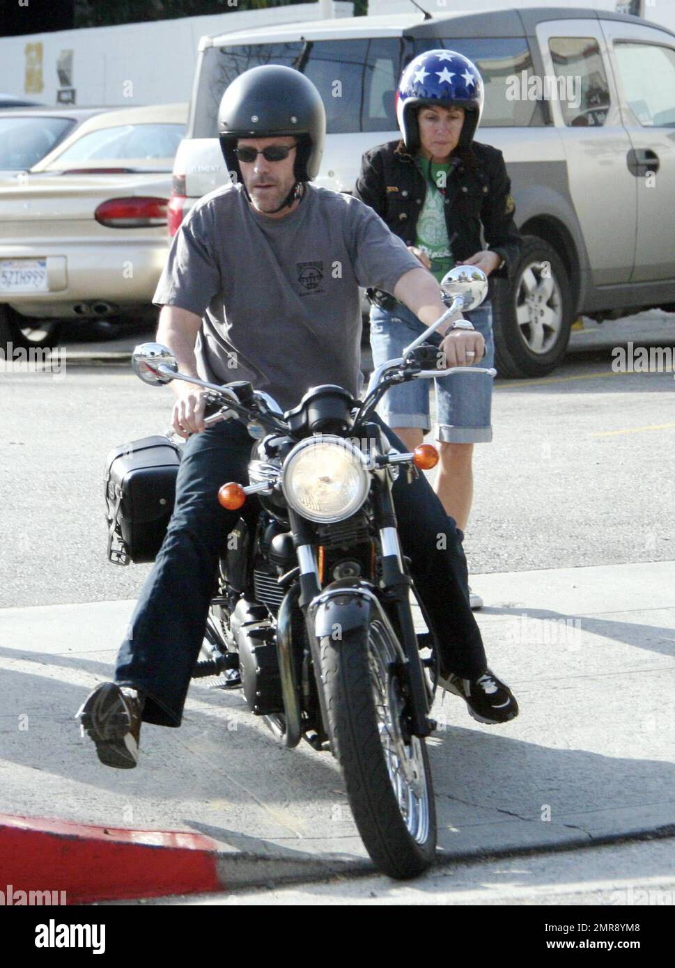 Exclusive!! Hugh Laurie and his wife Jo spend some rare time together