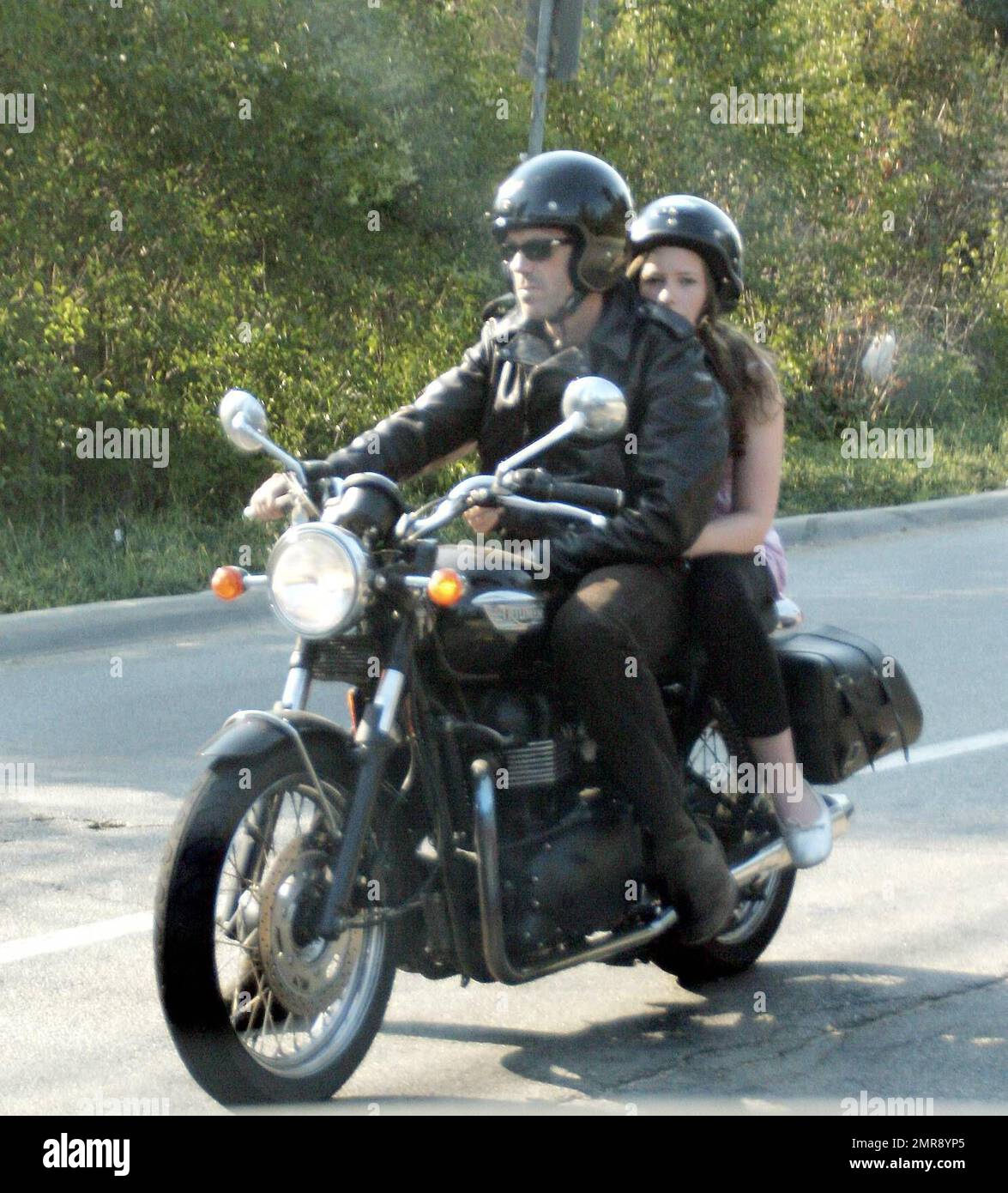 Exclusive!! Hugh Laurie takes his daughter Rebecca for a ride on his  Triumph Bonneville motorcycle in Beverly HIlls, Calif. 8/22/07 Stock Photo  - Alamy