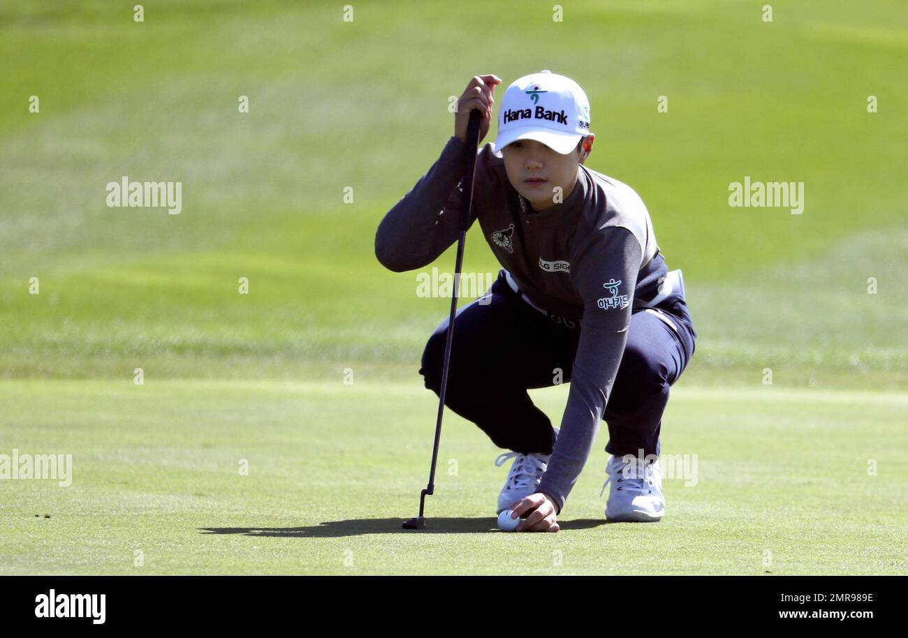 Sung Hyun Park of South Korea lines up her putt on the first hole ...