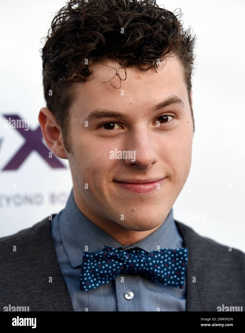 Actor Nolan Gould poses at the five year anniversary of the non profit