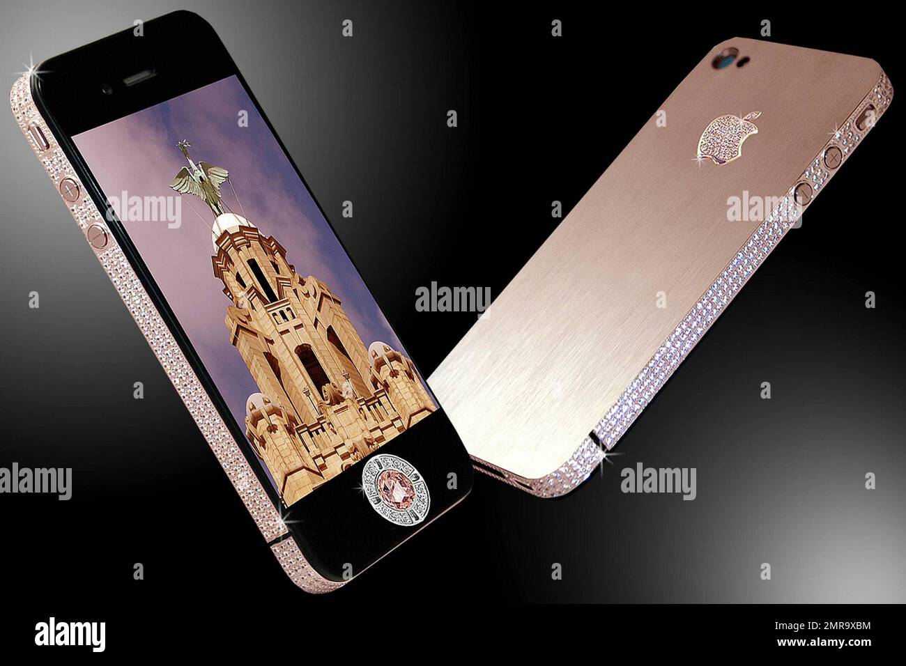 Are you looking for the most expensive and luxurious phone money can buy? Look no further. Stuart Hughes, known of the pioneer of luxurious gadgets, has now released the iPhone 4 Diamond Rose, the world's most expensive phone. With a price tag of $8 million, the phone features a number of exclusive touches including a bezel handmade from rose gold with approximately 500 individual flawless diamonds totaling over 100 carats and the rear surface, also made entirely of rose gold, with an added Apple logo featuring 53 diamonds. The main navigation is made of platinum holding a 7.4 carat pink diamo Stock Photo
