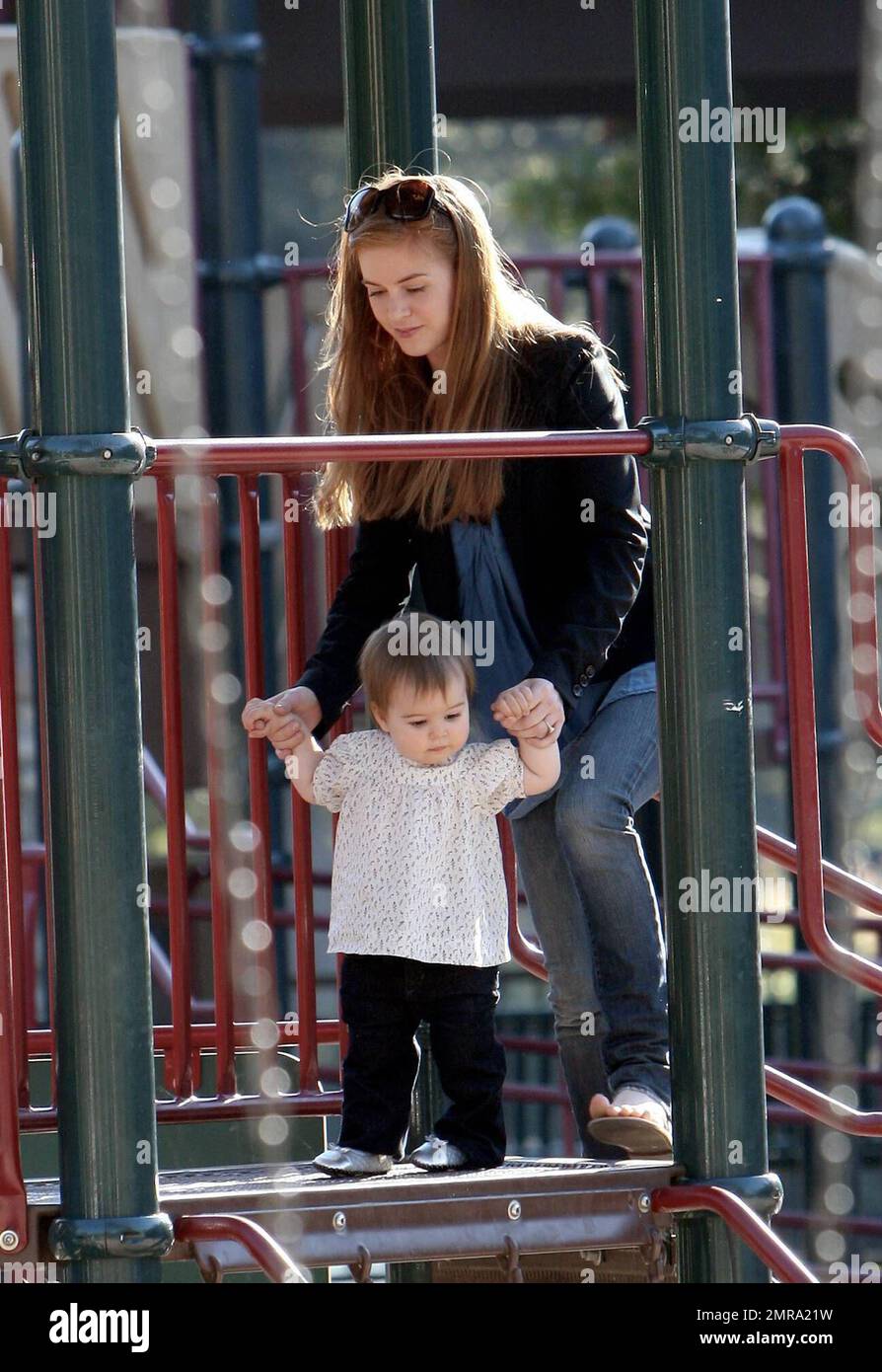 Actress Isla Fisher plays with her adorable daughter Olive Cohen, who turns  one year old in 10 days during their day out in a Beverly Hills park.  Father Sacha Baron Cohen did