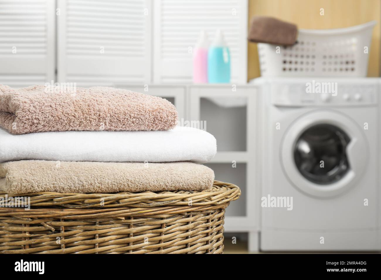 Stack of clean towels on white table in laundry room, space for text Stock  Photo - Alamy