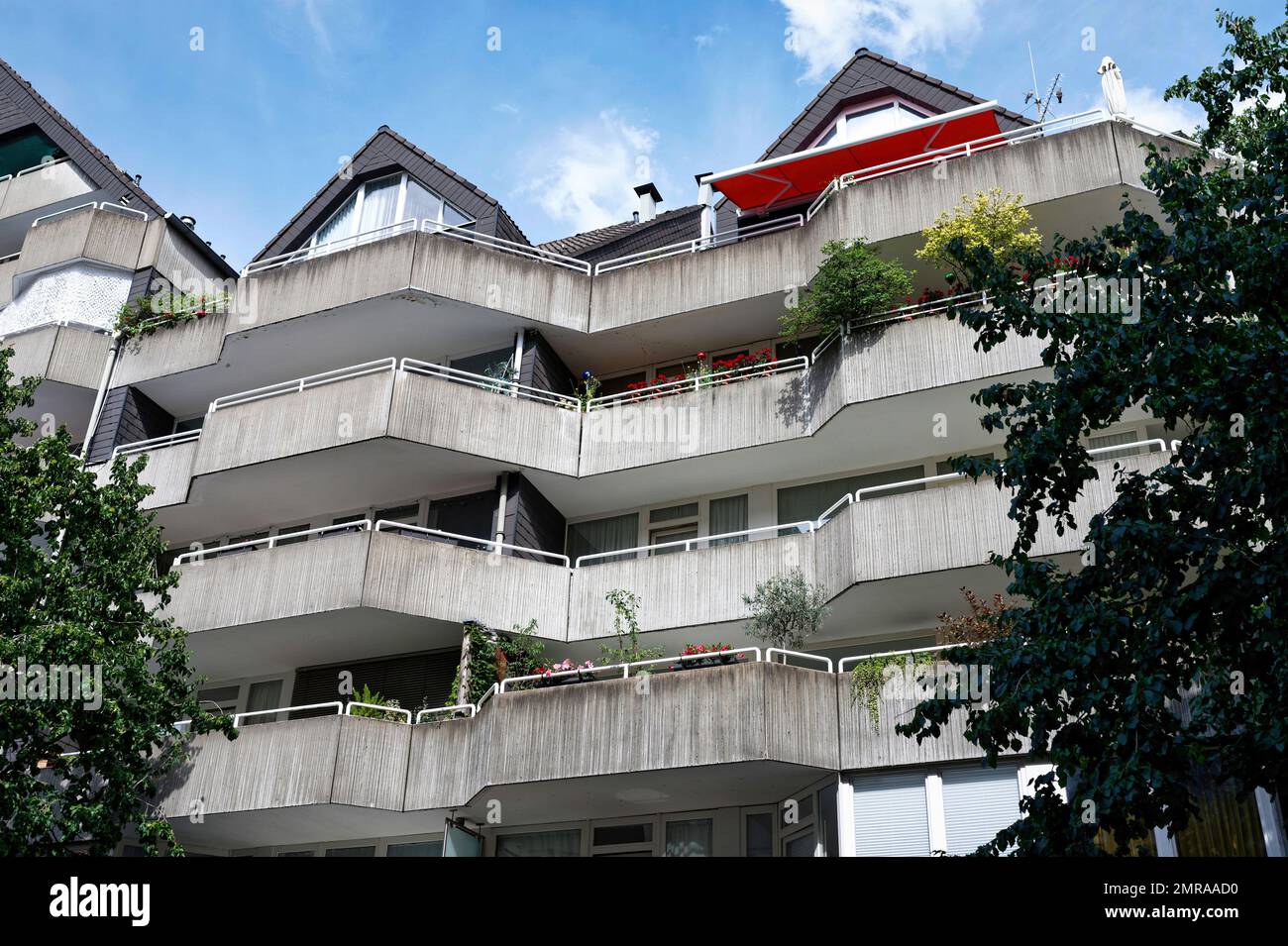 aged facade of a residential building made of exposed concrete Stock Photo