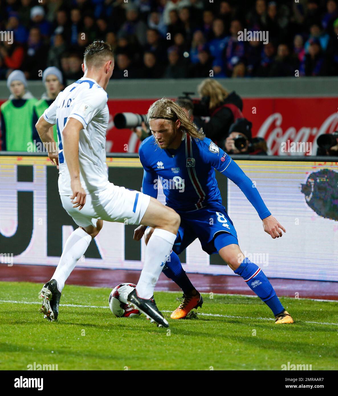Iceland's Birkir Bjarnason, right, vies for the ball with Kosovo's