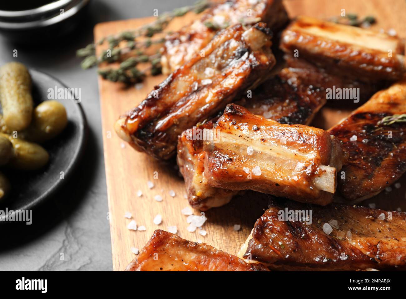 https://c8.alamy.com/comp/2MRABJX/delicious-grilled-ribs-served-on-table-closeup-2MRABJX.jpg