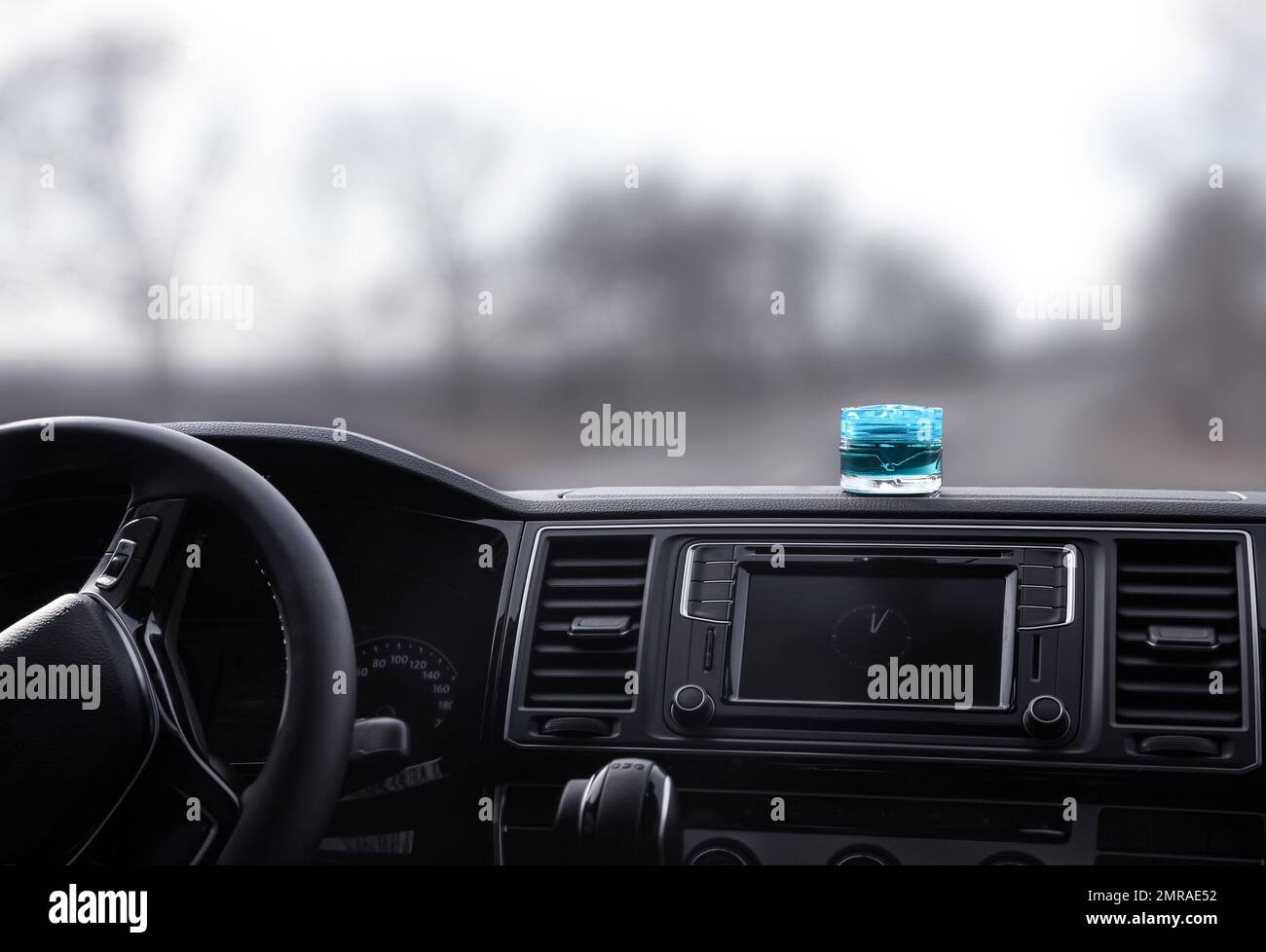 Stylish air freshener on dashboard in car Stock Photo Alamy