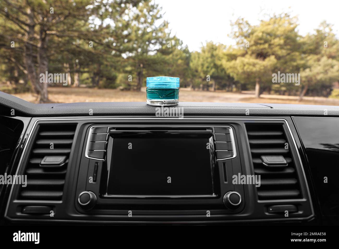 Stylish air freshener on dashboard in car Stock Photo Alamy