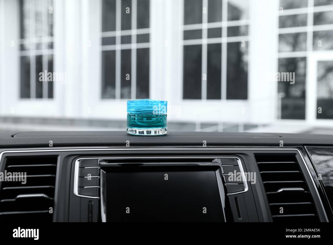 Stylish air freshener on dashboard in car Stock Photo Alamy