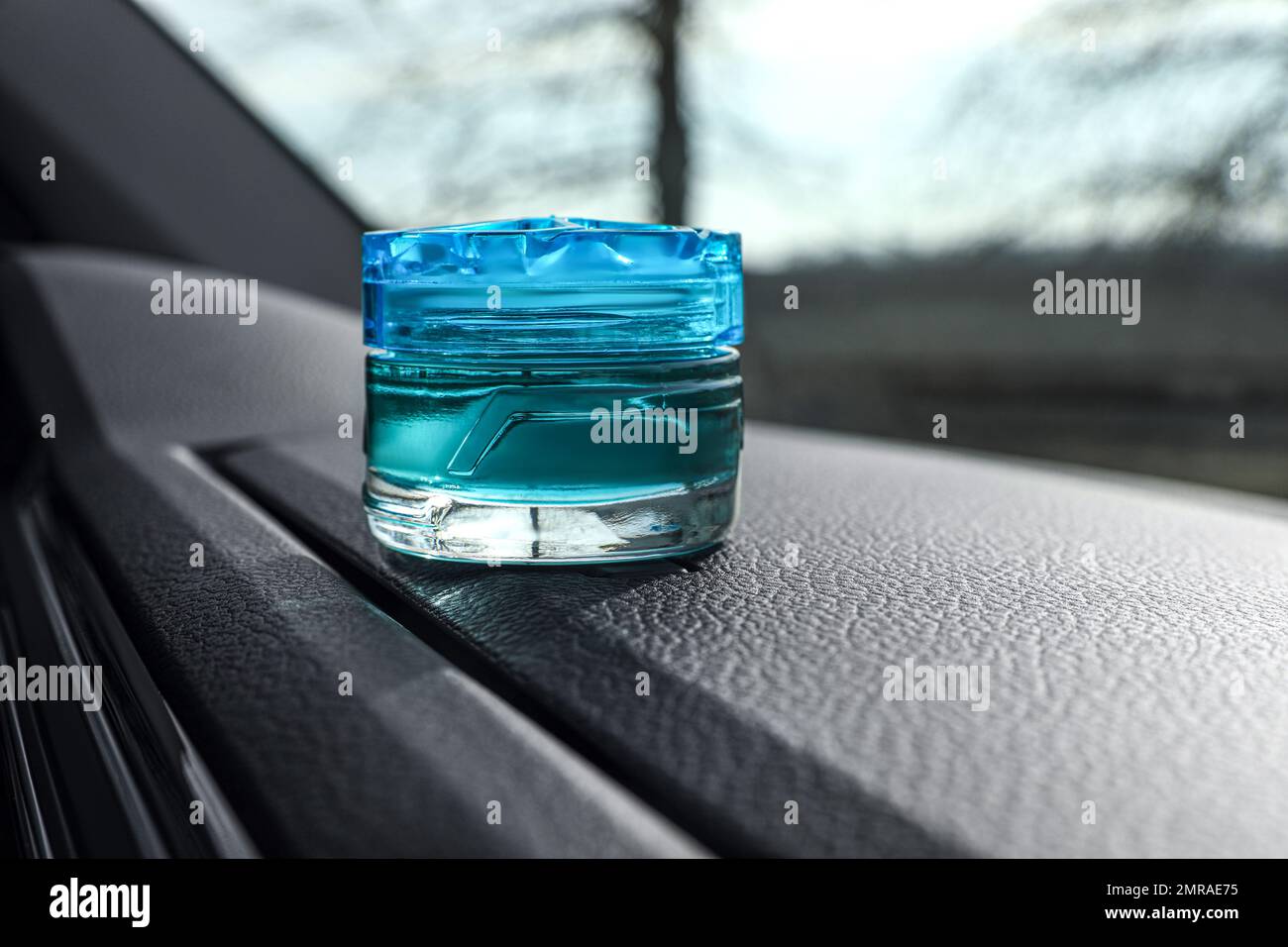 Stylish air freshener on dashboard in car Stock Photo Alamy