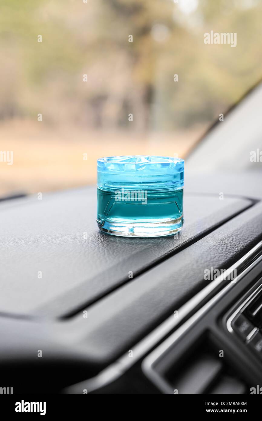 Stylish air freshener on dashboard in car Stock Photo Alamy