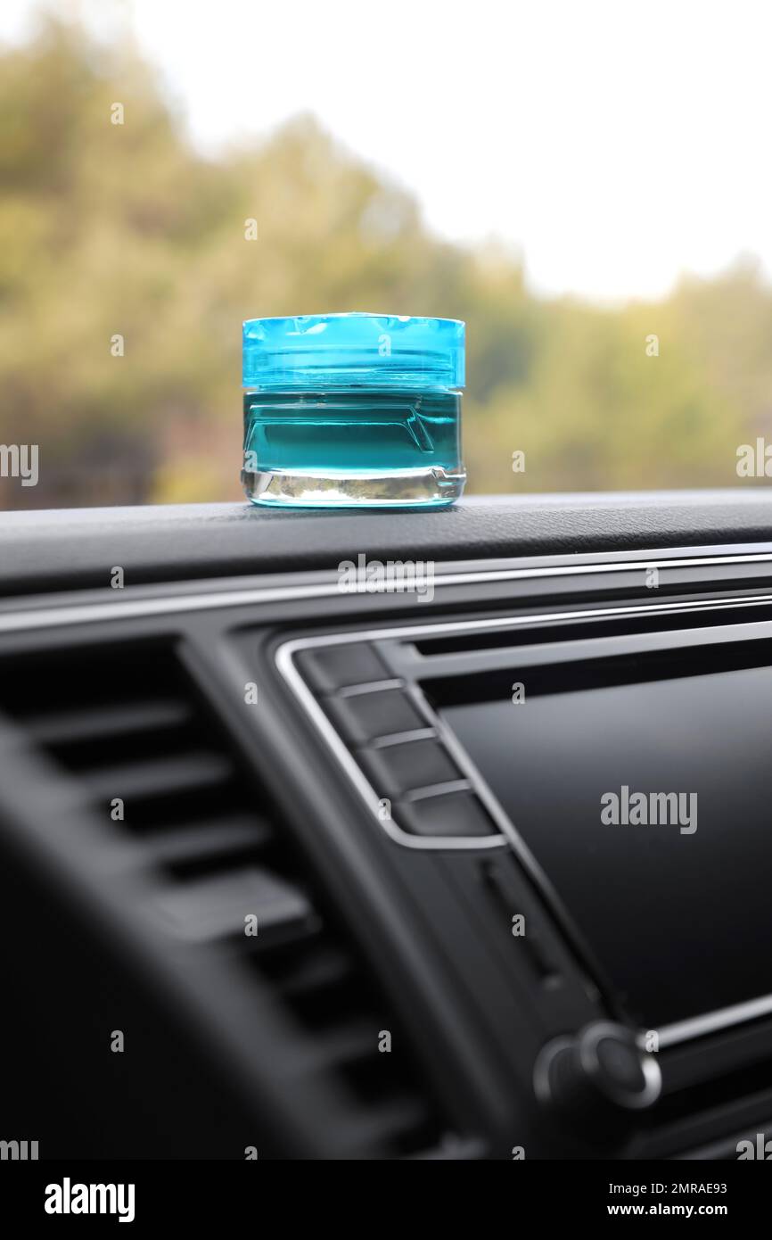 Stylish air freshener on dashboard in car Stock Photo Alamy