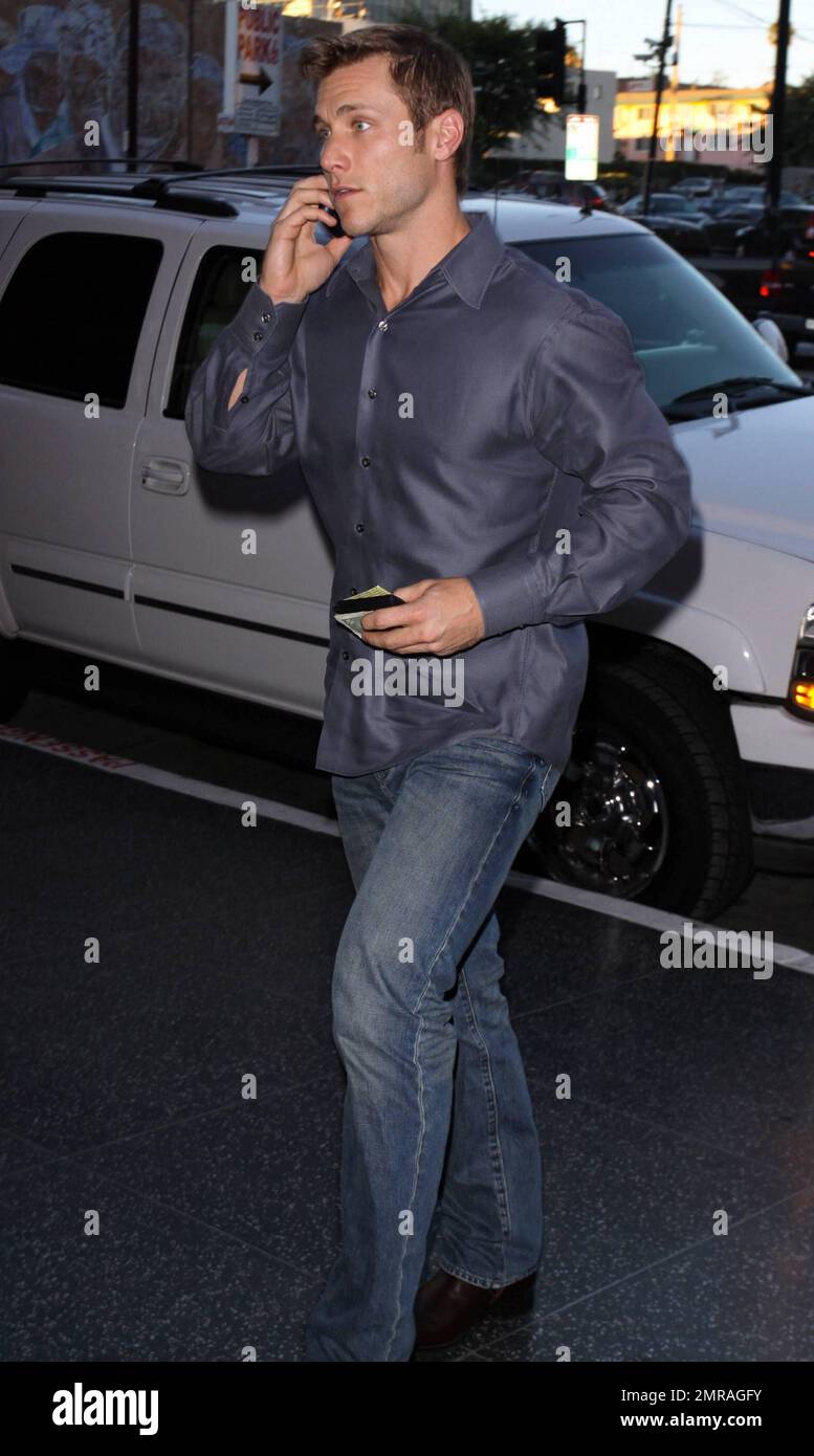 EXCLUSIVE!! Jake Pavelka chats on his cellphone as he arrives at Cleo at The Redbury in Hollywood, CA. 9/14/10. Stock Photo
