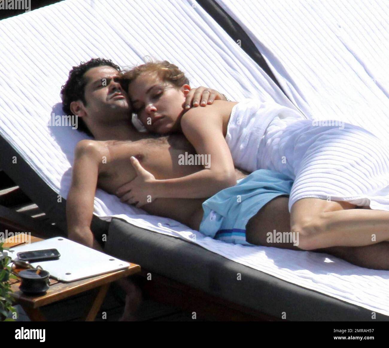 Exclusive!! Jamel Debbouze and his adoring wife Melissa Theuriau spend a  romantic day by the pool cuddling and kissing. The new parents, who had a  son on 3 December 2008 called Leon,