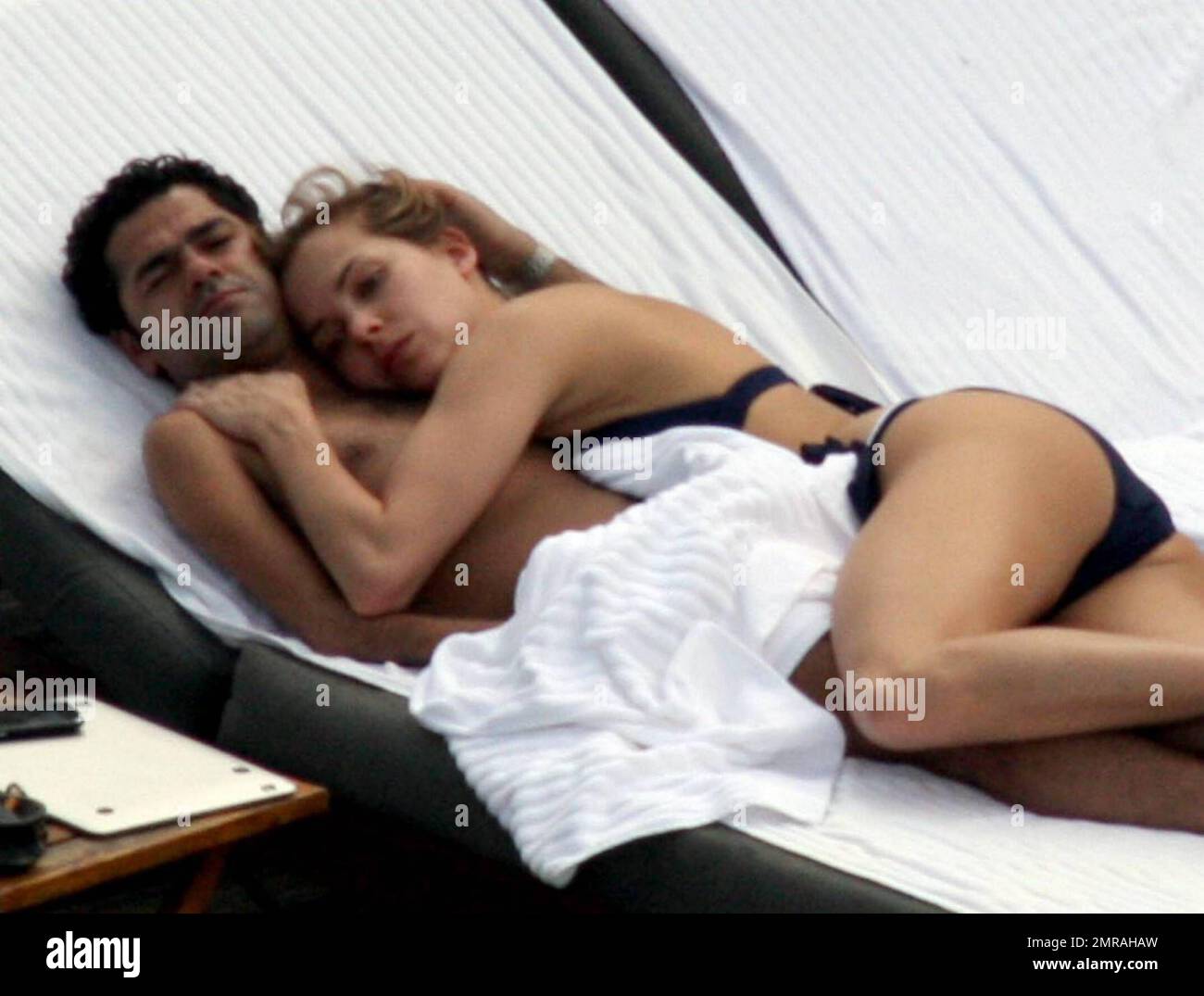 Exclusive!! Jamel Debbouze and his adoring wife Melissa Theuriau spend a  romantic day by the pool cuddling and kissing. The new parents, who had a  son on 3 December 2008 called Leon,