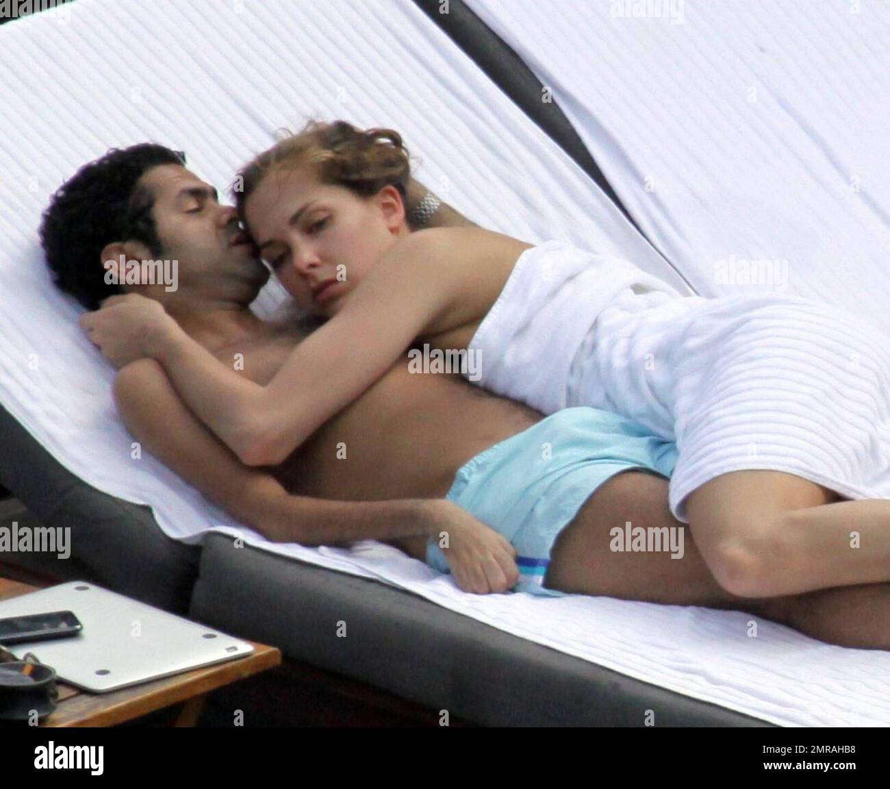 Exclusive!! Jamel Debbouze and his adoring wife Melissa Theuriau spend a  romantic day by the pool cuddling and kissing. The new parents, who had a  son on 3 December 2008 called Leon,
