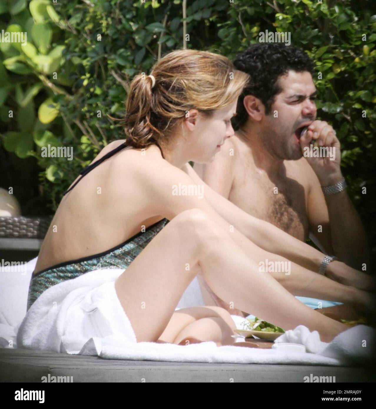 French actor Jamel Debbouze and wife Melissa Theuriau enjoy a day in the  sun wearing bathing suits at their exclusive Miami Beach hotel pool. The  couple had lunch and were very intimate