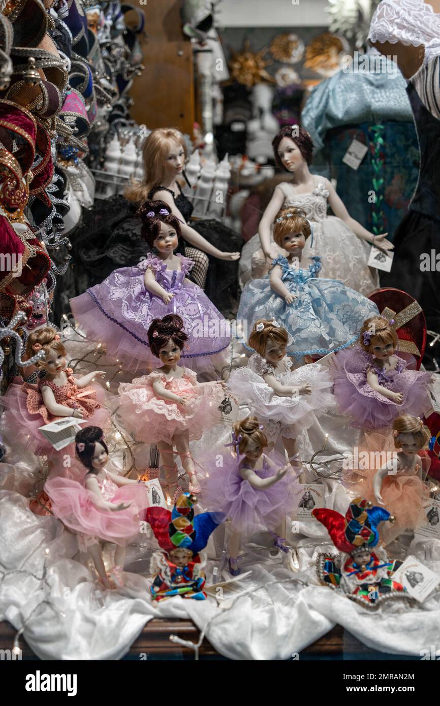 Author dolls and masks on a shelf in a store in Venice Stock Photo