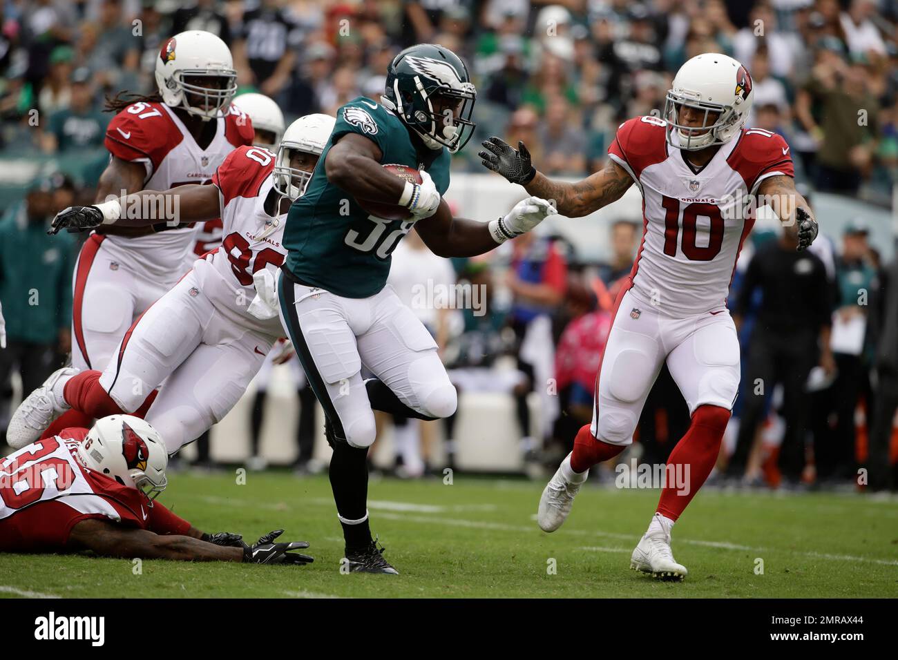 NO FILM, NO VIDEO, NO TV, NO DOCUMENTARY - The Philadelphia Eagles' Kenjon  Barner runs past the New York Jets' Jamari Lattimore, right, during the  first quarter in preseason action on Thursday