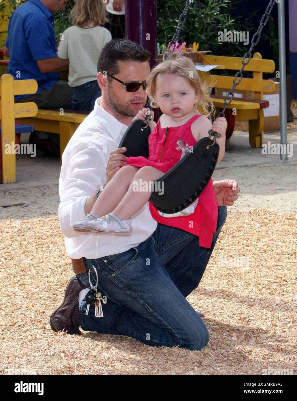 Actor/Director Jason Priestley was seen attending the 'Pregnancy Awareness Month' event in Santa Monica with his wife Naomi and 22 month old daughter Ava.  The event was held at the Little Dolphins By The Sea Preschool.  Jason and Ava spent most of their time playing at the playground.  Los Angeles, CA.  5/2/09. Stock Photo