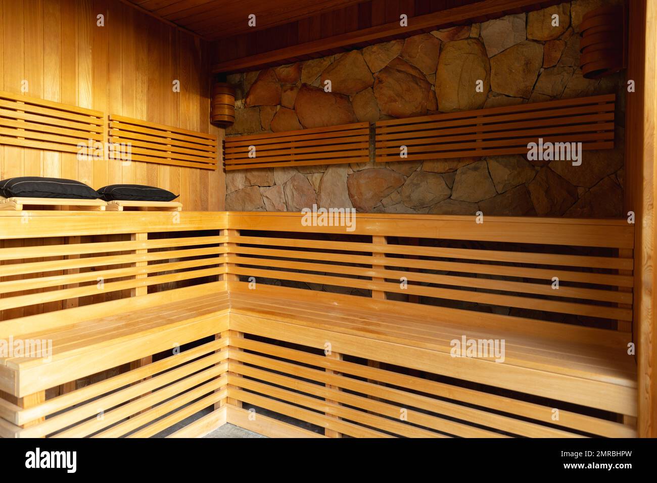 Wooden benches in sauna room at health spa, copy space Stock Photo