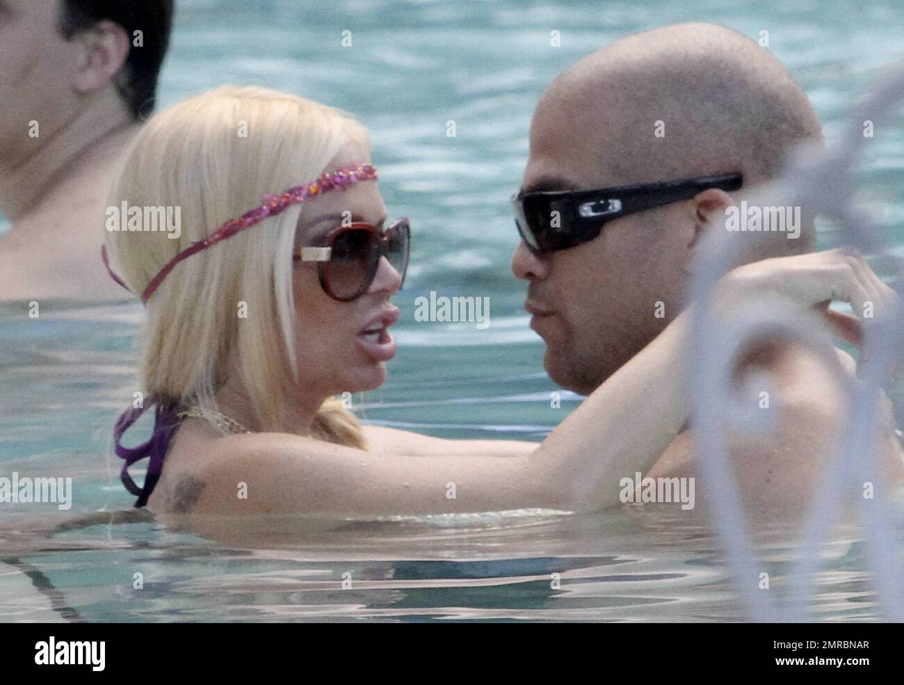 Jenna Jameson in a hot glittery purple bikini and hubby Titotiz being