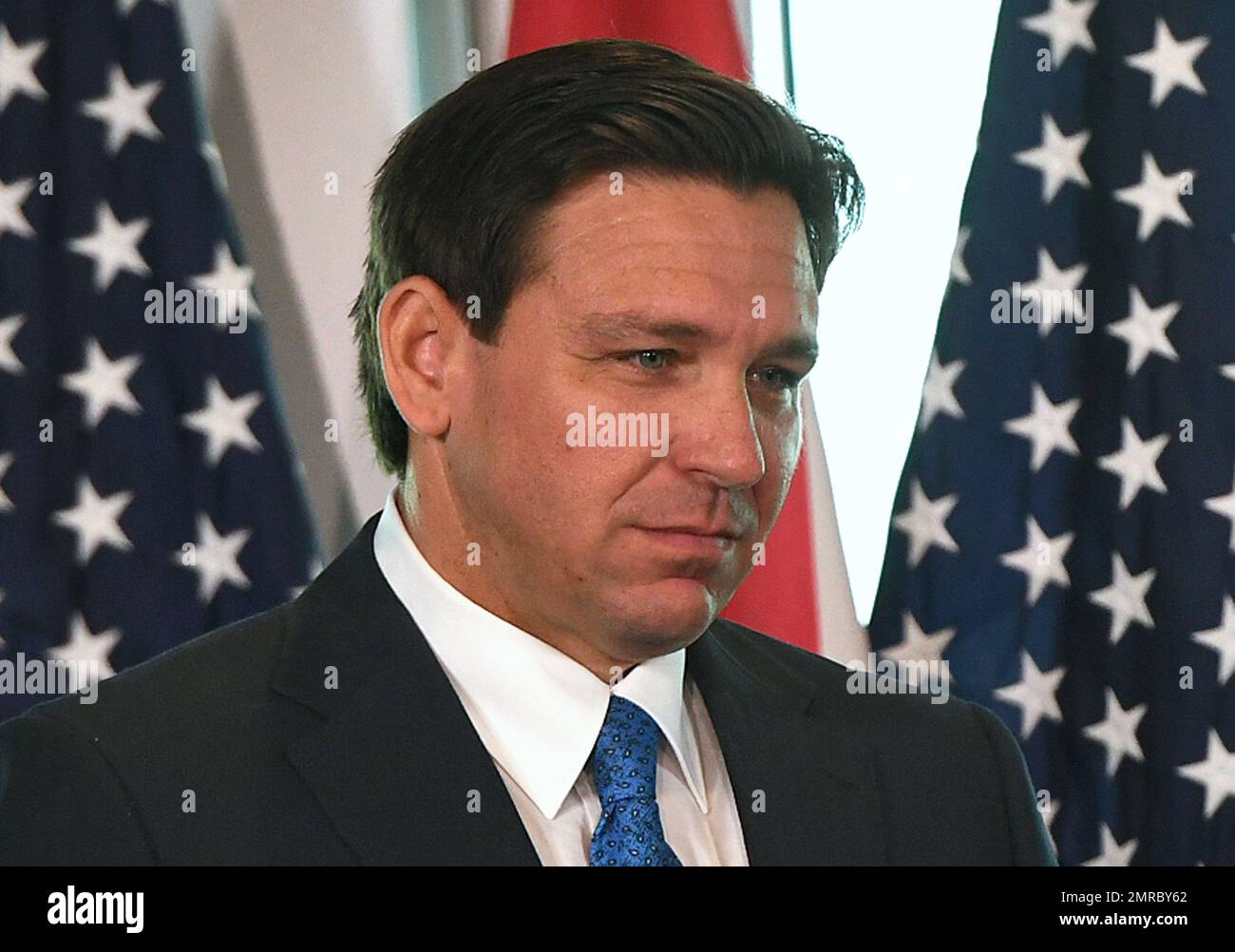 Auburndale, United States. 30th Jan, 2023. Florida Gov. Ron DeSantis listens during a press conference to announce the Moving Florida Forward initiative at the SUNTRAX Test Facility in Auburndale. If passed by the legislature, the proposal would expedite transportation projects over the next four years with $7 billion in funding. Credit: SOPA Images Limited/Alamy Live News Stock Photo