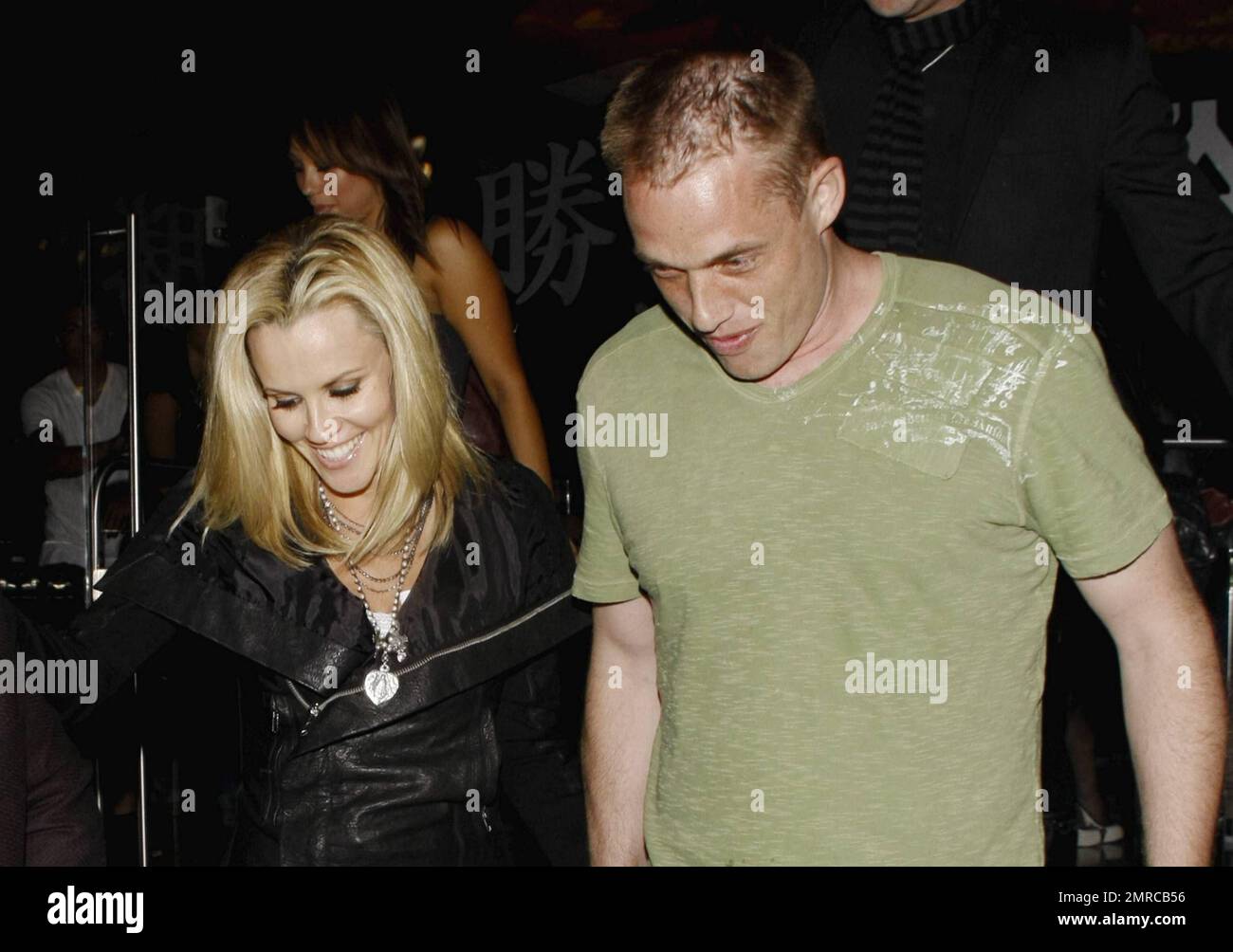 Jenny McCarthy holds hands with a new boyfriend as they leave Katsuya restaurant after dinner.  The former Playboy playmate recently split from long-time boyfriend Jim Carrey and has since been reportedly seen on dates with different men. McCarthy, who has an eight-year-old son with ex-husband John Mallory Asher, smiled and looked happy as she left the restaurant.  Since McCarthy and Carrey announced via Carrey's Twitter page that they were breaking up reports suggest that they remain amicable. Los Angeles, CA. 05/14/10. Stock Photo