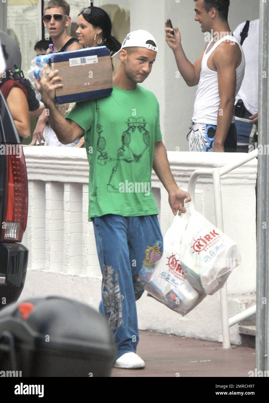 EXCLUSIVE!! 'Jersey Shore's' Mike 'The Situation' Sorrentino and DJ Pauly D carry some groceries into their temporary home after a major grocery shopping trip. Miami Beach, FL. 4/11/10. Stock Photo