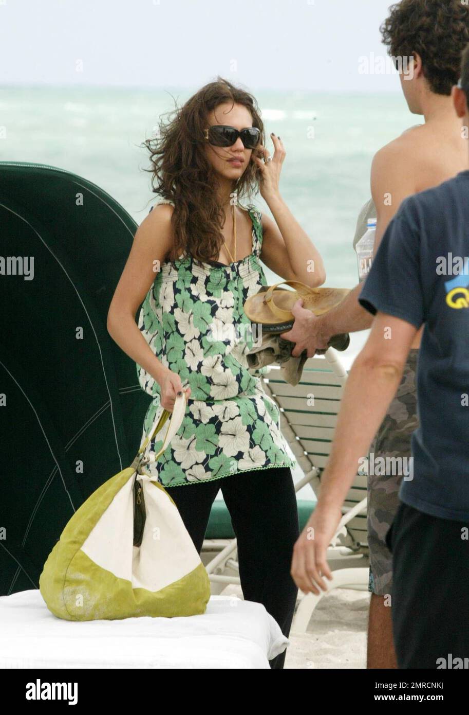 Jessica Alba and hunky fiance Cash Warren relax on Miami Beach in Fl. on New Year's Eve.  12/31/06 Stock Photo