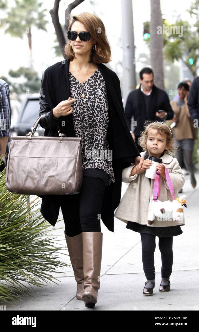 Jessica Alba strolls with daughter Honor, who carries along what looks