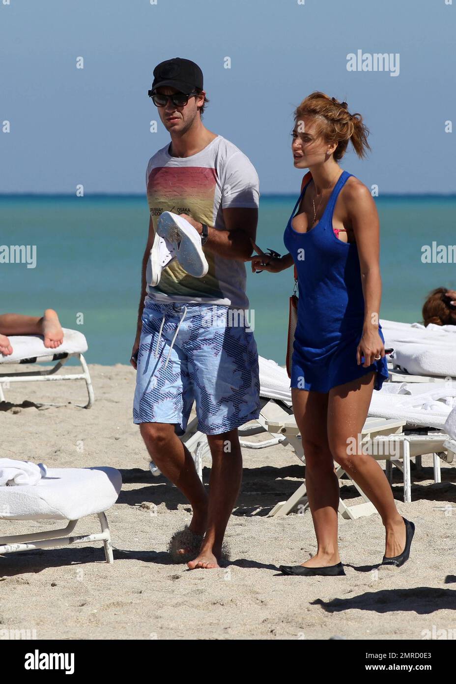 Argentine model, dancer and vedette, Jessica Cirio shows a bit more than intended as her bikini top slips while getting dressed. Cirio wore a pink patterned bikini while soaking up the sun with a male companion before heading back to their hotel. Miami Beach, FL. 29th October 2012. Stock Photo