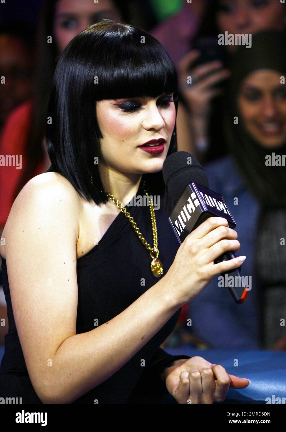 Wearing a black unitard with one black leg and a white one with a black squiggle down the front, singer Jessie J performs and answers questions during an appearance on 'Much Music.' Jessie seemed full of life during her question-and-answer session, making silly faces for the cameras and showing off her 'Stand Up' tattoo. During her performance, she made some 'tongue-in-cheek' faces, sipped from a bottle of water and put on a show that seemed to be loved by all the fans in attendance. Toronto, ON. 4/25/11. Stock Photo