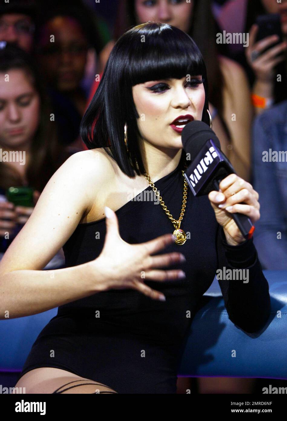 Wearing a black unitard with one black leg and a white one with a black squiggle down the front, singer Jessie J performs and answers questions during an appearance on 'Much Music.' Jessie seemed full of life during her question-and-answer session, making silly faces for the cameras and showing off her 'Stand Up' tattoo. During her performance, she made some 'tongue-in-cheek' faces, sipped from a bottle of water and put on a show that seemed to be loved by all the fans in attendance. Toronto, ON. 4/25/11. Stock Photo