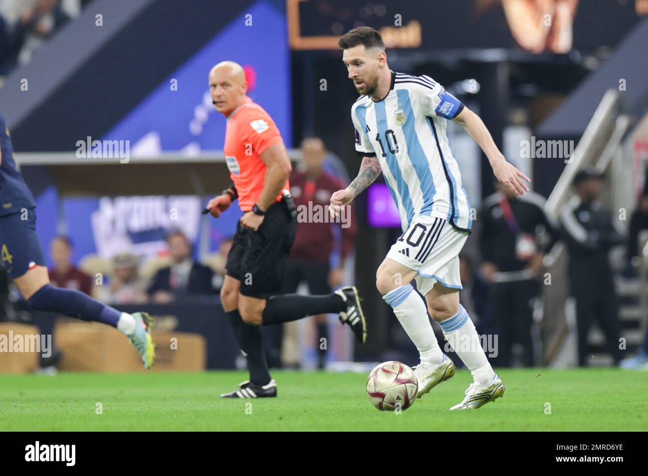 Referee Szymon Marciniak, Lionel Messi (Argentina) are seen during the FIFA World Cup Qatar 2022 Final match between Argentina and France at Lusail Stadium. Final score: Argentina 3:3 (penalty 4:2) France. Stock Photo