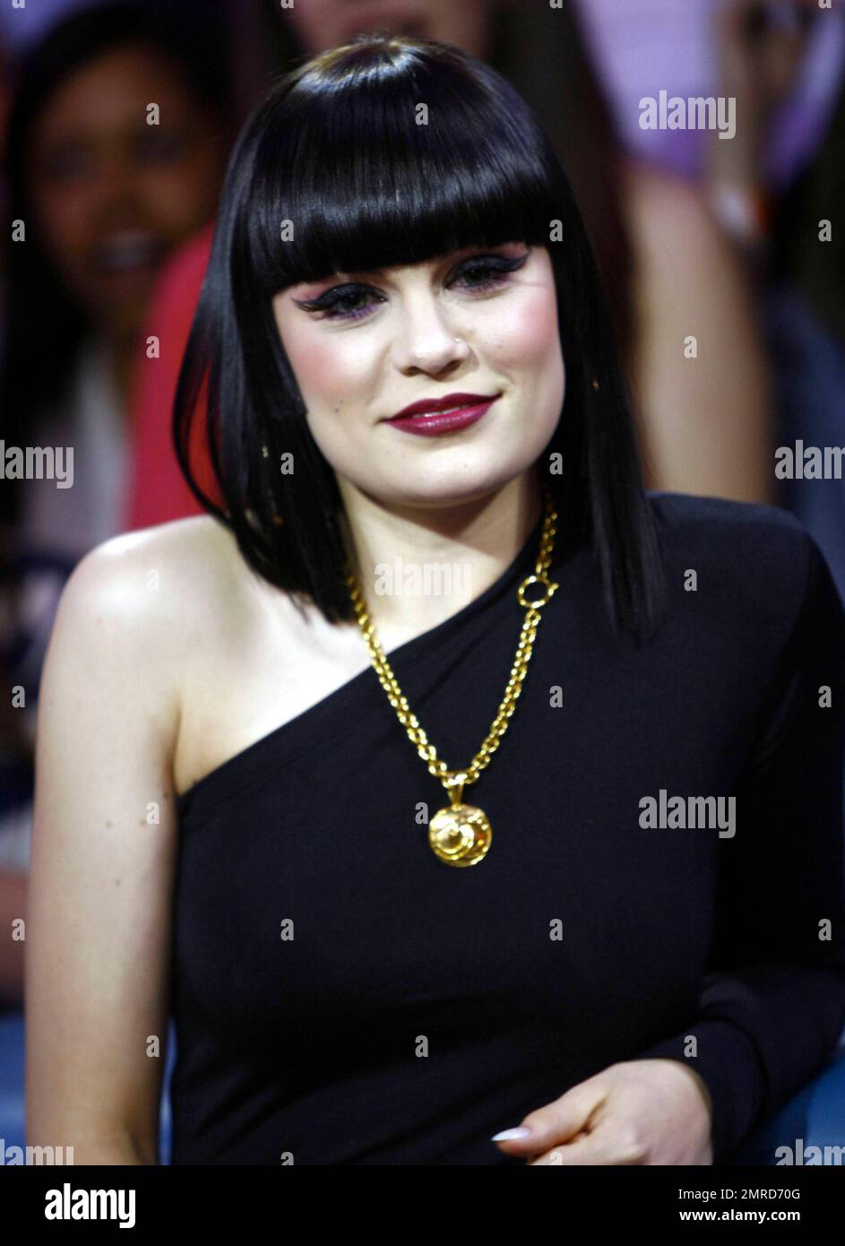 Wearing a black unitard with one black leg and a white one with a black squiggle down the front, singer Jessie J performs and answers questions during an appearance on 'Much Music.' Jessie seemed full of life during her question-and-answer session, making silly faces for the cameras and showing off her 'Stand Up' tattoo. During her performance, she made some 'tongue-in-cheek' faces, sipped from a bottle of water and put on a show that seemed to be loved by all the fans in attendance. Toronto, ON. 4/25/11. Stock Photo