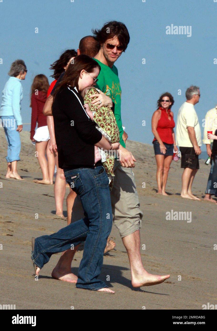 Jim Carrey celebrates the Fourth of July by hosting a beach party at his home. Carrey's daughter Jane brought his new grandson Riley Santana, who Jim showed off to guests that included Lisa Kudrow among other celebs. Malibu, CA. 7/4/10. Stock Photo