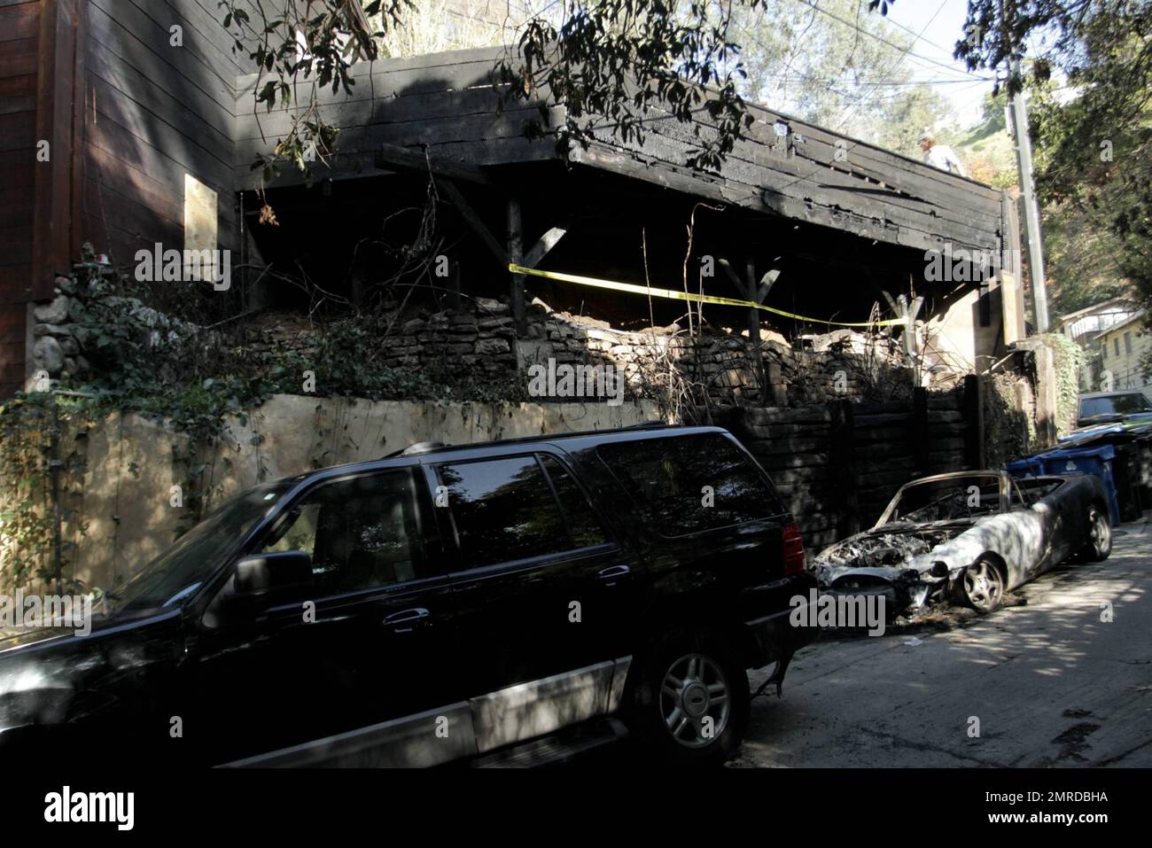 General views of rock legend Jim Morrison's former home after it was damaged by fire. The 1922 Hollywood home reportedly caught fire at 1:20 a.m. after flames spread from a nearby car. The blaze took 35 minutes to contain and was battled by 56 firefighters. According to the reports, the fire was one of 19 overnight arson attacks that plagued Hollywood and West Hollywood early Friday morning. The home was where Morrison wrote The Doors' album 'Waiting for the Sun' and portions of 'The Soft Parade.' The street on which it is located was the insporation for the song 'Love Street,' which was featu Stock Photo