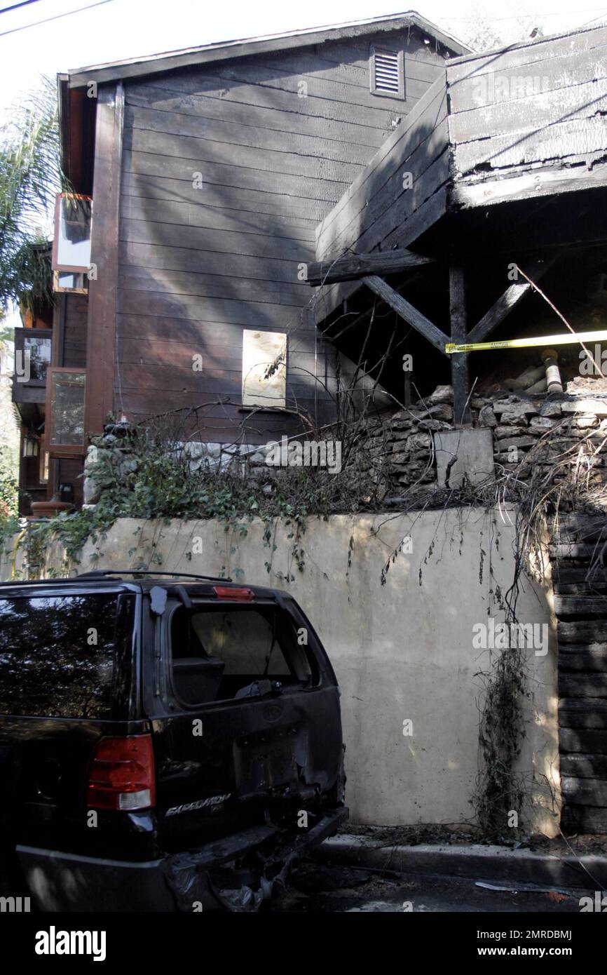 General views of rock legend Jim Morrison's former home after it was damaged by fire. The 1922 Hollywood home reportedly caught fire at 1:20 a.m. after flames spread from a nearby car. The blaze took 35 minutes to contain and was battled by 56 firefighters. According to the reports, the fire was one of 19 overnight arson attacks that plagued Hollywood and West Hollywood early Friday morning. The home was where Morrison wrote The Doors' album 'Waiting for the Sun' and portions of 'The Soft Parade.' The street on which it is located was the insporation for the song 'Love Street,' which was featu Stock Photo