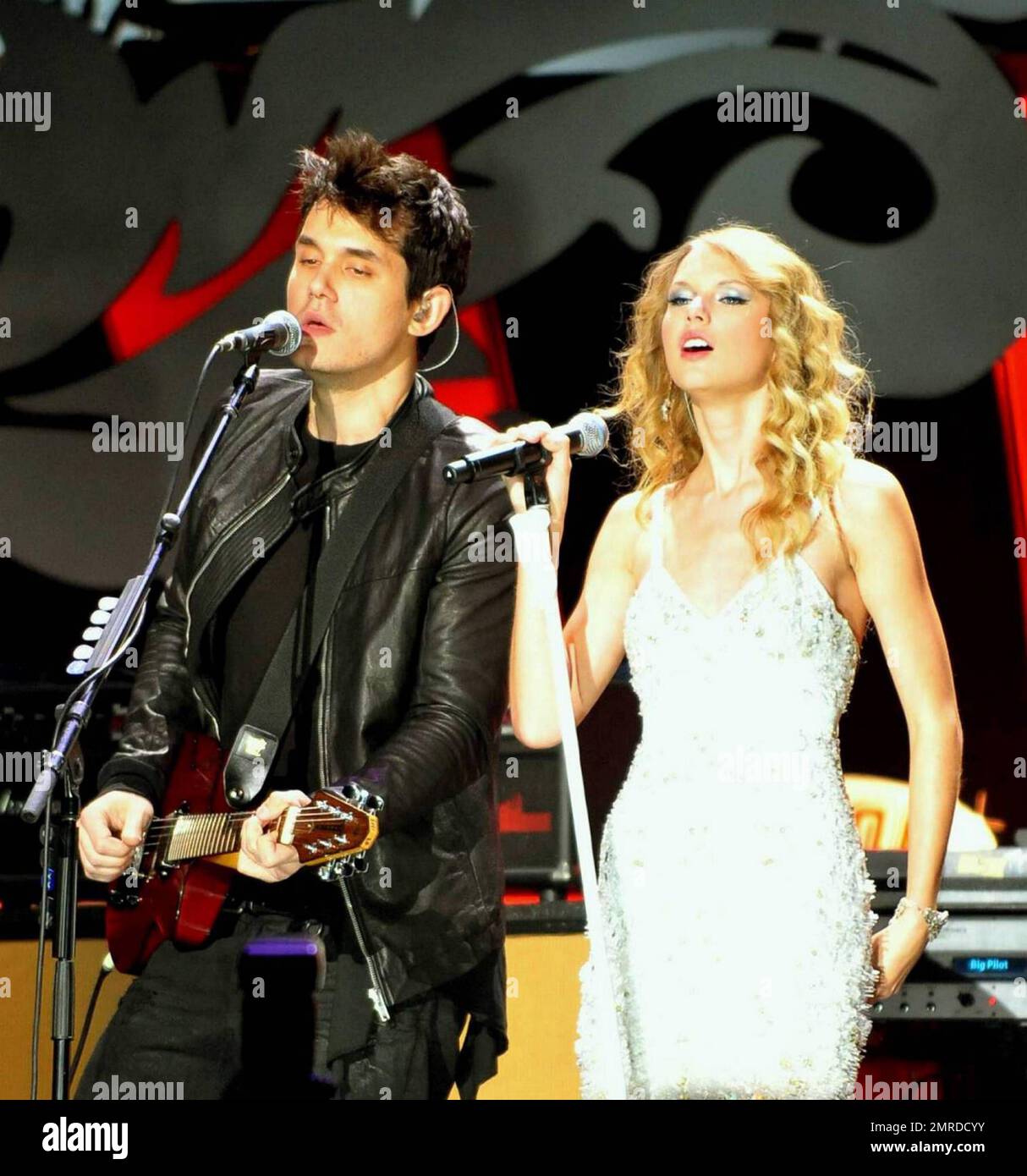 Singer John Mayer is joined by Taylor Swift on stage at the