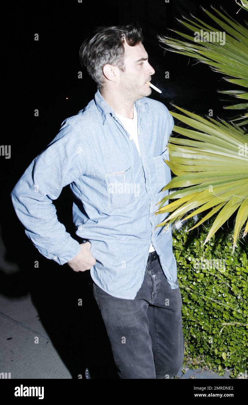 Actor turned rapper, Joaquin Phoenix, smokes a cigarette as he arrives to  the forum for a Prince concert. Los Angeles, CA. 04/28/11 Stock Photo