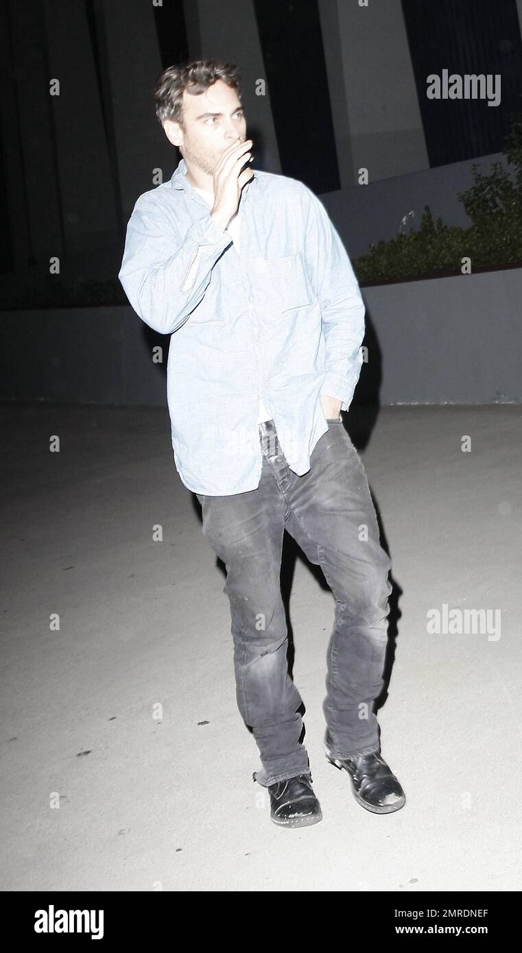 Actor turned rapper, Joaquin Phoenix, smokes a cigarette as he arrives to  the forum for a Prince concert. Los Angeles, CA. 04/28/11 Stock Photo