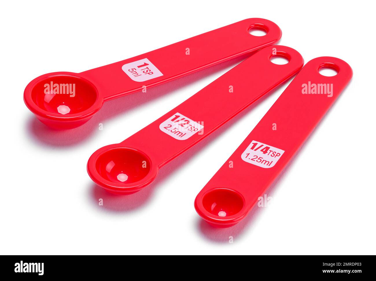 Three Measuring Spoons Cut Out on White. Stock Photo