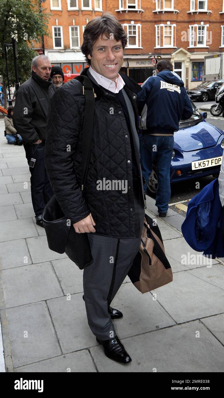 EXCLUSIVE!! Comedian John is all smiles as he poses for photos outside BBC Radio 2
